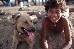 Borroloola, Northern Territory, Australia - A boy and his dog on Kangaroo Island in the Gulf of Carpentaria.