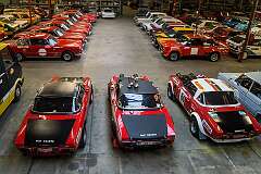 Overview of the main hall of the Abarth Works Museum in Lier, Belgium, with in the foreground three Fiat Abarth 124 Spider Rally Stradale.