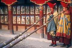 Hemis, Ladakh, India, 1979 - Monks playing the “Duncheng” horns at a Buddhist ceremony in Hemis Gompa.
