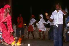 Port au Prince, Haiti, 1980 - A priestess at the fire ritual at a public Vaudou (Voodoo) ceremony.