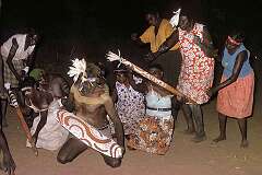 Lajamanu, NT, Australia, 1976 - Dance with a “kurdiji”, wooden shield painted with the dreaming designs, and decorated “kuturu” fighting sticks at a “Jardiwanpa” ceremony.
