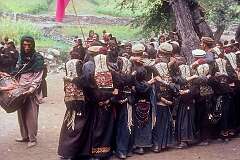 Bumburet, Pakistan, 1979 - Drumming and women dancing at a “Krakal” funeral ceremony of the Kalash people.
