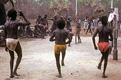Pirlangimpi, NT, Australia, 1986 - Clan dance at a Tiwi “Pukumani” funeral ceremony on Melville Island. Each clan has its own dance associated with their totem.