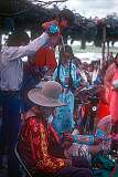 Wakapamni, South Dakota, USA, 1980 - A Lakota child is lifted up during his traditional name-giving ceremony at a pow-wow at Wakapamni Lake.