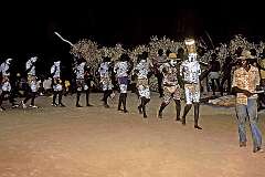 Borroloola, NT, Australia, 1983 - Dancers file onto the ceremonial ground at the start of the “Mandiwala” boys' initiation ceremony.