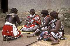 Bethany, Eswatini, 1972 - A candidate “sangoma” or diviner does an examination in “kuphengula” or divination, part of her “iNtfwasa” graduation ceremony.