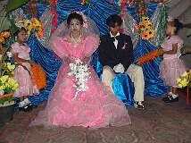 Gili Air, Indonesia, 2005 - Bride and groom, flanked by bridesmaids at a Sasak Muslim wedding on the small island of Gili Air, off the north-west coast of Lombok.