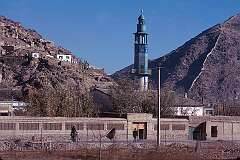 The blue-tiled minaret of a mosque near the University of Kabul.