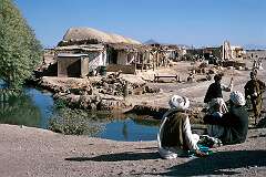 The village of Farahrud, on the road between Herat and Kandahar is built next to a small stream that provides it with essential water in an otherwise barren landscape.