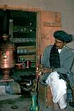 A man prepares his water pipe in one of the many “chai kana” or tea houses in Kandahar, a favourite meeting place for the men of Afghanistan.