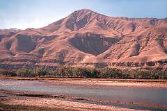 Mountain scenery  and river on the road to Pul-e-Khumri, between Kunduz and Kabul.