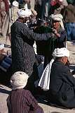 Shopping for clothes on Mazar's bustling market.