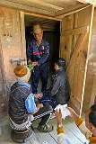 Mihin Pugang and other men performing a Donyi Polo ceremony at the rice barn of Tajang Village as part of the Eli ceremony.