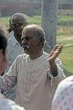 A Hindu man, with a Krisha “tilak” on his forehead, telling a story.