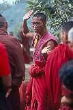 Buddhist monks debating at the Tsuglagkhang. The Challenger is clapping to punctuate the end of the “question”, an argument in response to the Defender's answer.