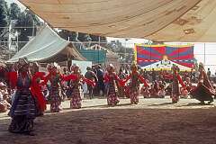 The flag of Tibet forms a background in the Lhamo (Tibetan Opera) performance.
