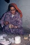 Abdul Aziz Khan's wife making a papier-mâché box in their workshop.