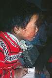 A little boy in class, writing English, in Lamdon Model School.