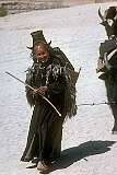 A traditional Ladakhi woman leading yaks.