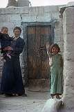 Nekey Dolma (8) with her mother and sister, in front of their home in the Tibetan Refugee Settlement in Choglamsar.