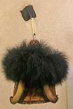 Headgear for a Konyak Naga man, made with fine bamboo splints, cane, orchid stem and dyed goat's hair, and ornamented with bear fur, boar tusk, hornbill feathers, goat hair plume and bear claws.