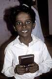 A young Tamil boy on the steps to the Rock Fort temple.