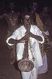 Playing the Nadaswaram, a large wind instrument, one of the oldest and most sacred instruments in South India, uring a religious procession on the streets of Rameswaram.