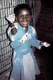 A girl after she decorated a statue with flour.