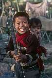 Rinchin Dorjee, a young Bhutanese boy with his bow and arrow and his little brother Rinchin Paden at Jangsa Gompa, a Bhutanese Monastery in Kalimpong.