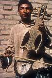 A Balochi man playing a “Suroz” in  Mashhad. It is considered the national instrument of the Baloch people In Balochistan, southeastern Iran and western Pakistan.