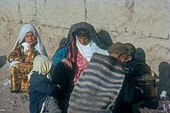 A family waiting at the bus station in Mashhad.