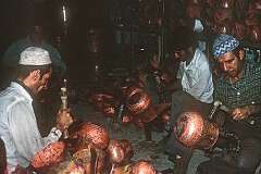 Coppersmiths at work, in the Grand bazaar of Tehran.