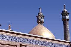A gold coloured dome and minarets of the shrine of Hazrat Fatima Masuma-e-Qum in Qom, one of the focal centers of the Shi'a branch of Islam.