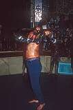 A man swings a “kabbiida”, a heavy iron bow on the cord of which heavy rings are strung, at Zurkhaneh, the traditional gymnasium of urban Persia and adjacent lands.