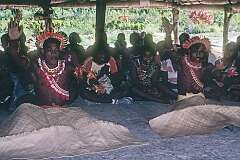 Men performing traditional Gilbertese “sit-down” dancing.