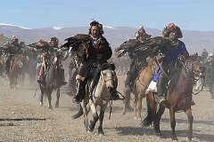 Sagsai, Bayan Ölgii, Mongolia, 2011 - Kazakh eagle hunters with their “bürkit”, hunting eagles, at the Altai Eagle Festival.