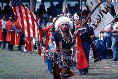 Window Rock, Arizona, USA, 1980 - A native American dancer with war bonnet of the Lakota (Sioux) people at the Navajo Fair,