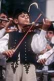 Strážnice, Morava, Czechia, 1989 - A young Roma violin player.