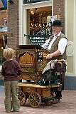 Harlingen, Fryslân, Netherlands, 2008 - Playing a small barrel organ.