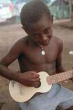 Aruliho, Guadalcanal, Solomon Islands, 1982 - Playing his guitar.