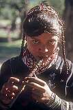 Bumburet, Khyber Pakhtunkhwa, Pakistan, 1979 - A Kalash girl playing a flute.