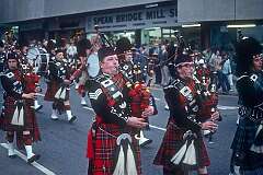 Inverness, Scotland, 1979 - A Highlander pipe band marching.