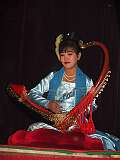 Mandalay, Myanmar, 2007 - Playing a “saung gauq”, Burmese harp.