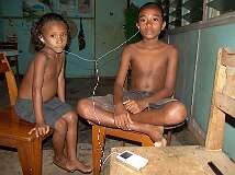 Samarai, Milne Bay, Papua New Guinea, 2006 - Listening to music on an iPod.