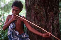 Matautu, Temutu, Solomon Islands, 1983 - A Polynesian girl playing a kind of jaw harp, bamboo with a string, on Tikopia island.