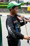 Bandung, Java, Indonesia, 2009 - Playing a violin for tips.