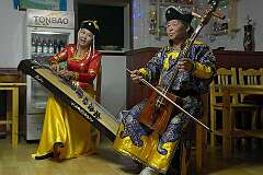 Kharkhorin, Övörkhangai, Mongolia, 2011 - Playing the Yatga zither and Morin khuur fiddle, by the Erdene Zuu Group.