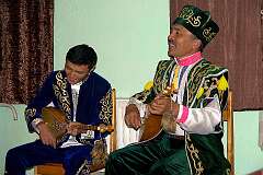 Ölgi, Bayan Ölgii, Mongolia, 2011 - Bokenbai and Kögershin, ethnic Kazakh performers, playing the “dombyra”.