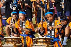 Matsuyama, Shikoku, Japan, 2014 - Girls performing vigorous Taiko drumming.
