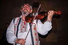 Mileștii Mici, Moldova, 2015 - A violin player in the wine cellar of Mileștii Mici Winery.
